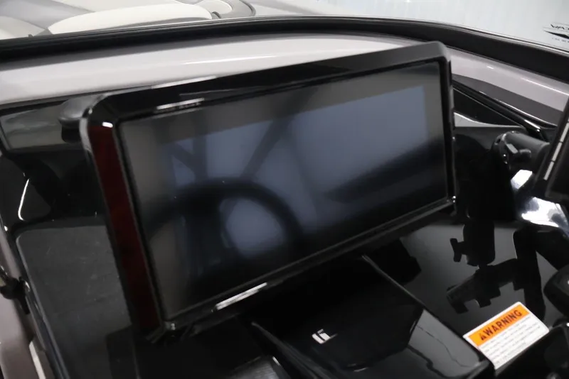 Slide: The Image of 2026 Yamaha Boats 252XE dashboard with touchscreen display and warning label. - 44