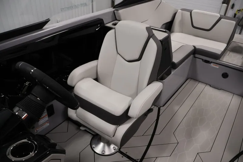 Slide: The Image of 2026 Yamaha Boats 252XE interior with sleek captain's chair and modern design. - 48