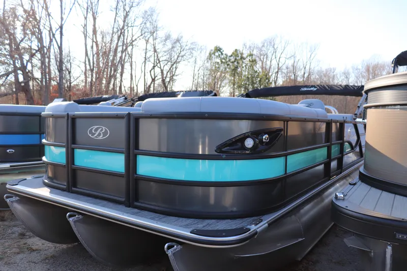 The Image of 2026 Bentley Pontoons Legacy 223 Swingback, sleek design, docked outdoors, winter setting. - 0