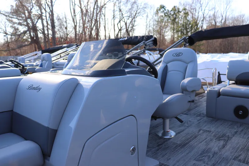 Slide: The Image of 2026 Bentley Pontoons Legacy 223 Swingback interior with steering console and seating. - 4
