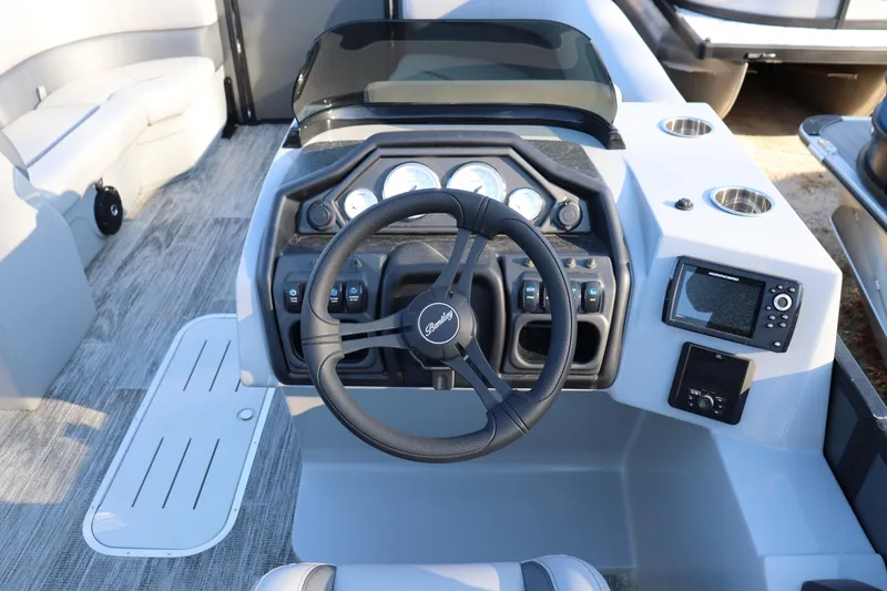 Slide: The Image of 2026 Bentley Pontoons Legacy 223 Swingback dashboard with steering wheel and controls. - 5