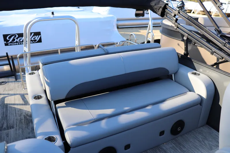 Slide: The Image of 2026 Bentley Pontoons Legacy 223 Swingback interior with luxurious seating and cup holders. - 7