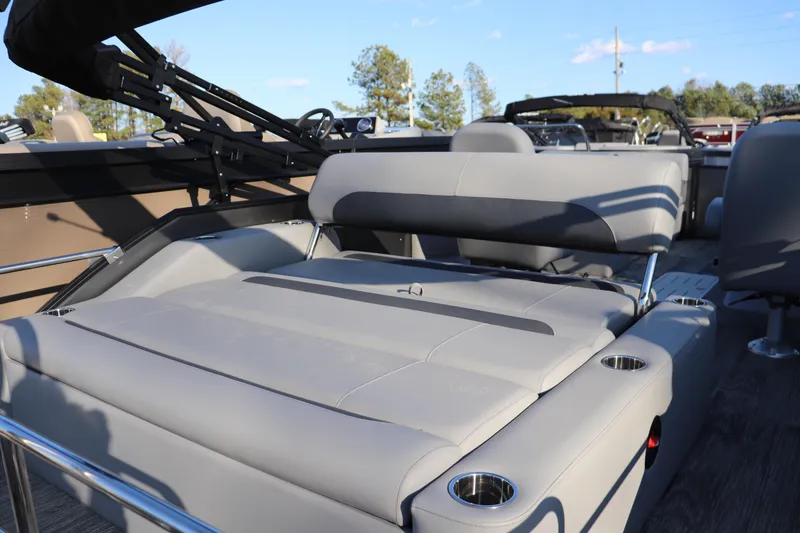 Slide: The Image of 2026 Bentley Pontoons Legacy 223 Swingback with luxurious seating and cup holders. - 9