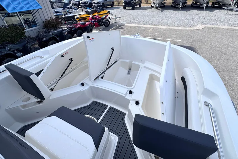Slide: The Image of 2026 Trophy CC20 boat interior with open storage compartments and seating. - 14