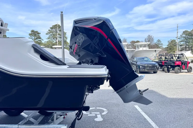 Slide: The Image of 2026 Trophy CC20 boat with powerful outboard motor in a parking lot. - 4