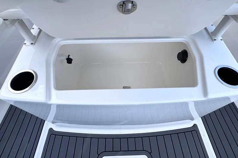 Slide: The Image of 2026 Trophy CC20 boat storage compartment with cup holders and non-slip deck. - 9