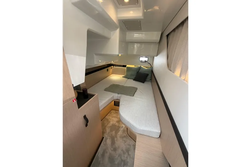 Slide: The Image of Luxurious interior cabin of 2026 Jeanneau TH38 yacht with modern design and cozy bedding. - 11