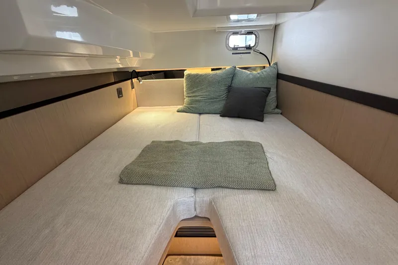 Slide: The Image of Cozy cabin interior of 2026 Jeanneau TH38 yacht with comfortable bedding. - 12
