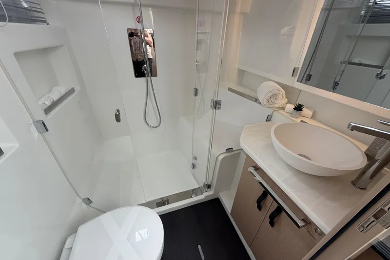Slide: The Image of Modern bathroom in 2026 Jeanneau TH38 yacht with sleek fixtures and elegant design. - 13