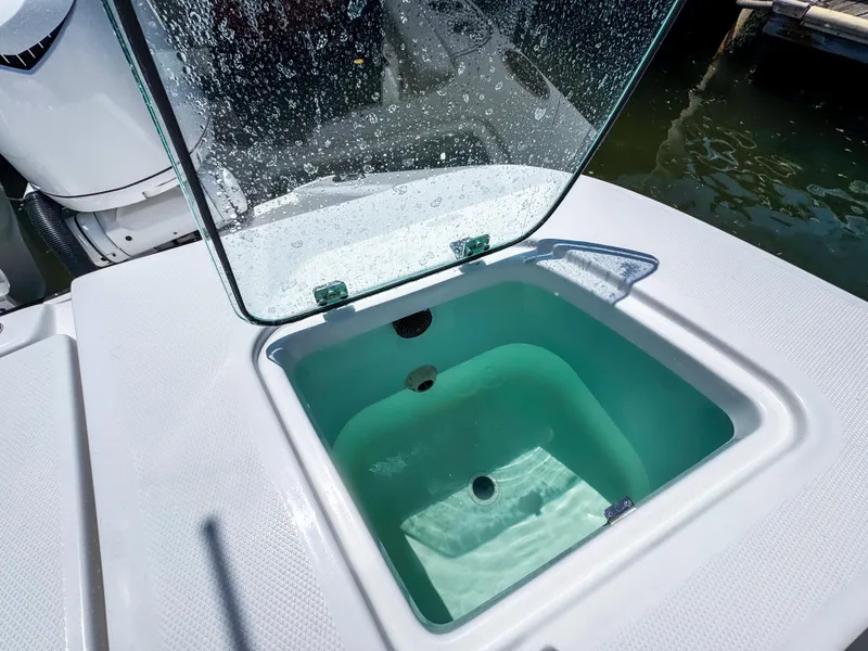 Slide: The Image of Open livewell on 2025 Edgewater 370CC boat, showcasing clean design and functionality. - 14