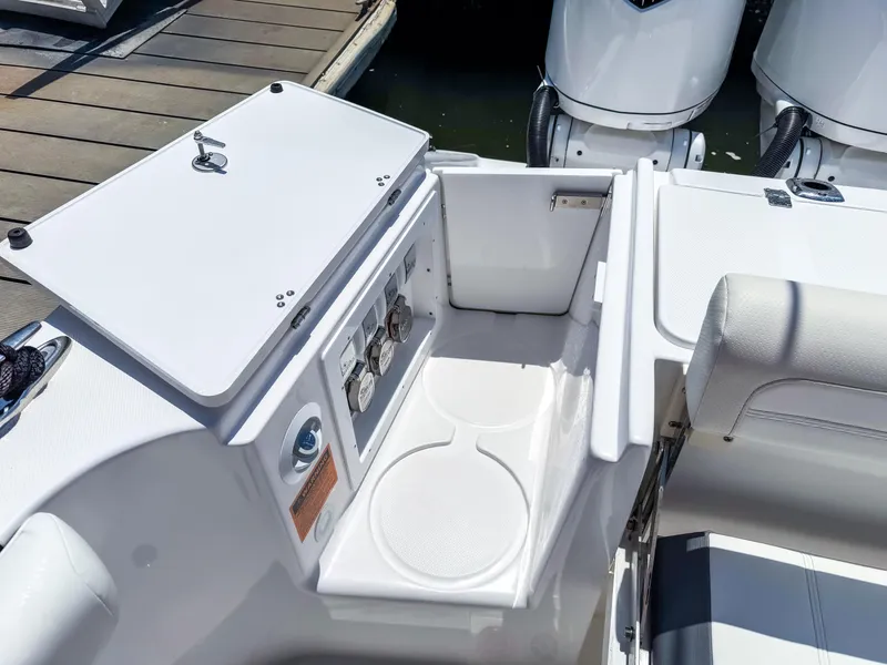 Slide: The Image of 2025 Edgewater 370CC boat interior with storage compartment and seating area. - 29