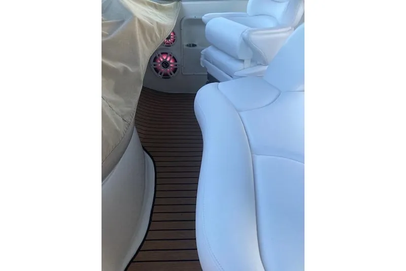 Slide: The Image of Interior of 2001 Sea Ray 380 Sundancer with white seating and wood flooring. - 14