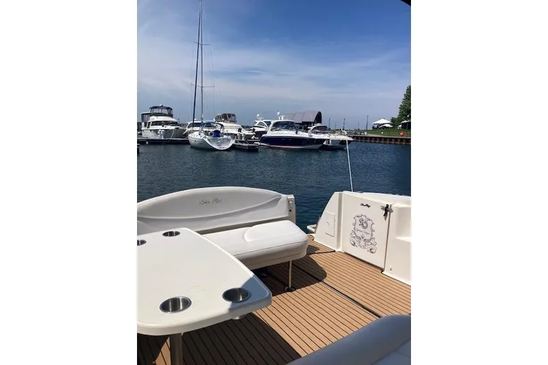 Slide: The Image of 2001 Sea Ray 380 Sundancer yacht docked at marina with scenic view. - 19