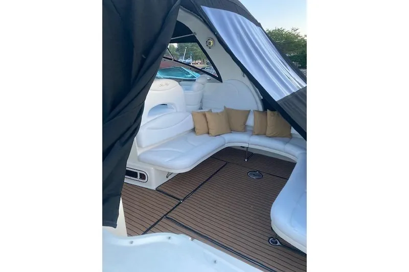 Slide: The Image of Luxurious interior of 2001 Sea Ray 380 Sundancer with white seating and cushions. - 27