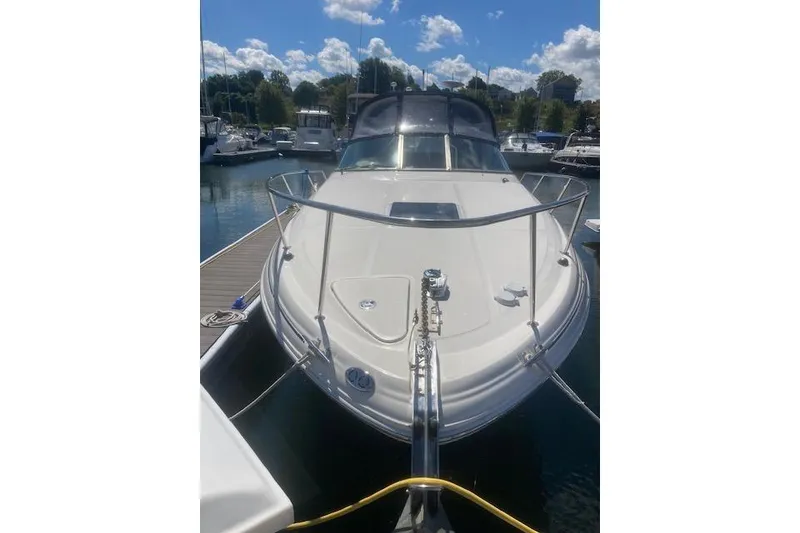 Slide: The Image of 2001 Sea Ray 380 Sundancer docked at marina under blue sky. - 30