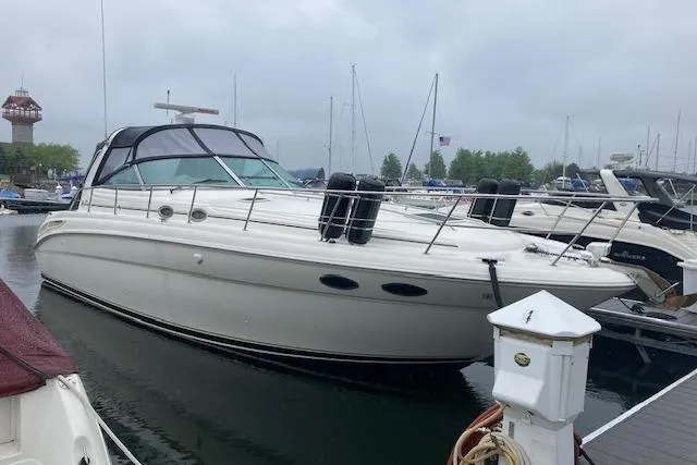 Slide: The Image of 2001 Sea Ray 380 Sundancer yacht docked at marina on a cloudy day. - 39