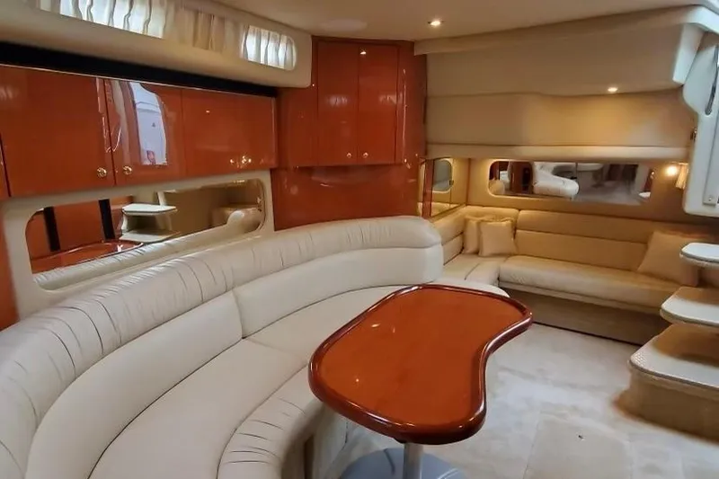 Slide: The Image of Luxurious interior of a 2001 Sea Ray 380 Sundancer yacht with elegant seating and wood finishes. - 4