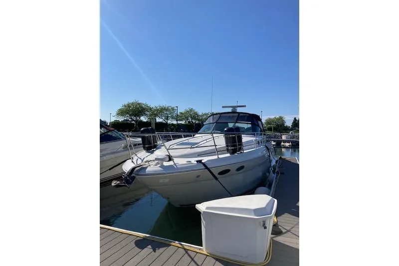 Slide: The Image of 2001 Sea Ray 380 Sundancer yacht docked under clear blue sky. - 40