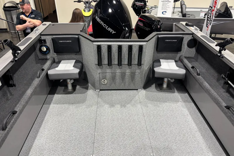 Slide: The Image of 2026 Crestliner 2050 Commander boat interior with seating and storage compartments. - 5