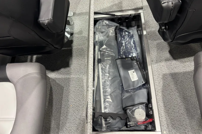 Slide: The Image of Storage compartment in 2026 Crestliner 2050 Commander boat, featuring organized equipment and accessories. - 6