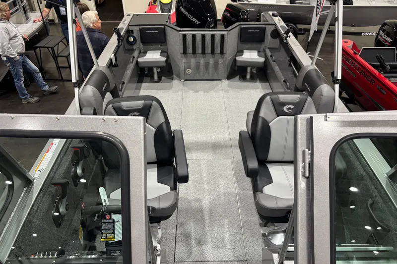 Slide: The Image of 2026 Crestliner 2050 Commander boat interior with seating and fishing rod holders. - 8