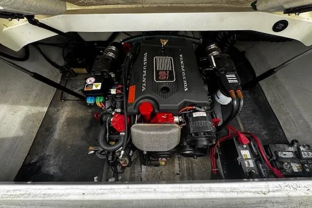 Slide: The Image of Engine compartment of a 2002 Cobalt 262 boat featuring a Volvo Penta engine. - 12