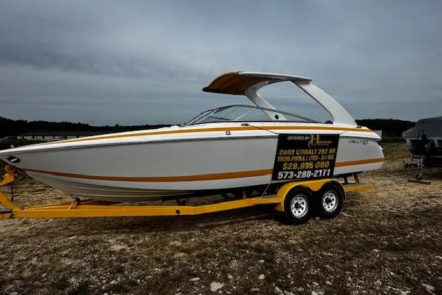 Slide: The Image of 2002 Cobalt 262 boat on trailer with contact information displayed on the side. - 3