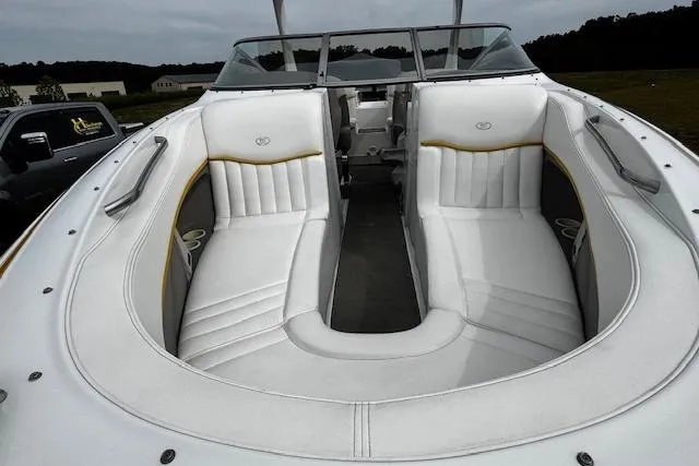 Slide: The Image of 2002 Cobalt 262 boat with white leather seating and open bow design. - 31