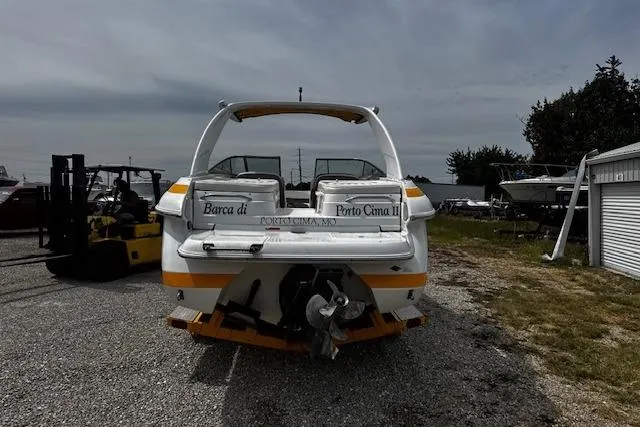 Slide: The Image of Rear view of a 2002 Cobalt 262 boat on a trailer in a storage area. - 8