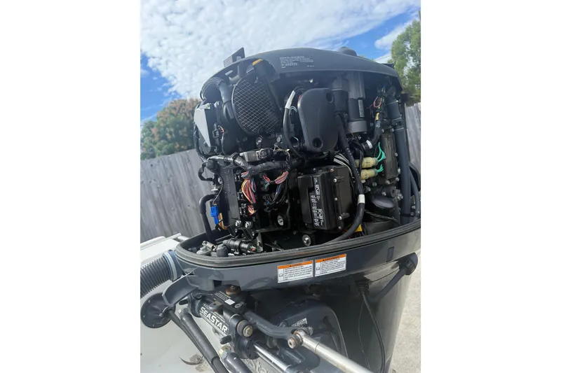 Slide: The Image of 2016 NauticStar 25 XS boat on trailer, viewed from below against blue sky. - 10