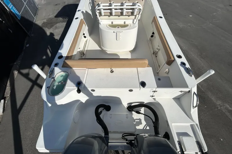 Slide: The Image of 2016 NauticStar 25 XS boat interior with seating and storage compartments. - 13