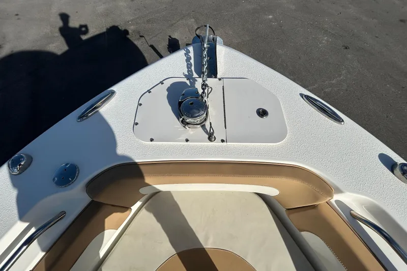 Slide: The Image of 2016 NauticStar 25 XS boat bow with anchor and seating area. - 28