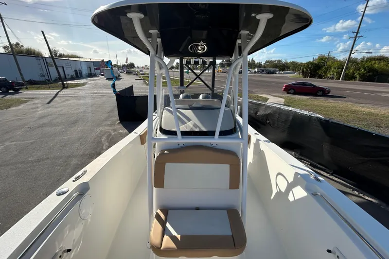 Slide: The Image of 2016 NauticStar 25 XS boat with T-top and seating, parked outdoors. - 35