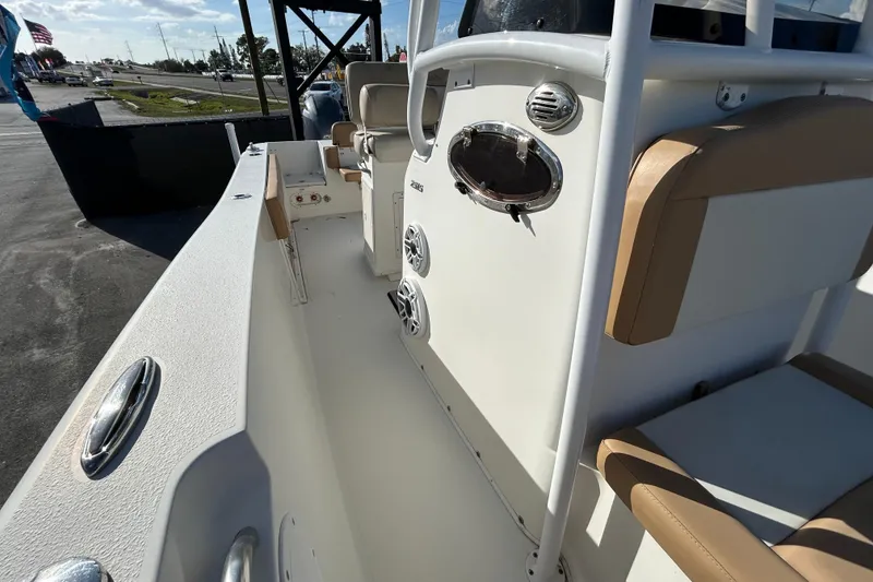 Slide: The Image of 2016 NauticStar 25 XS boat interior with seating and control panel. - 37