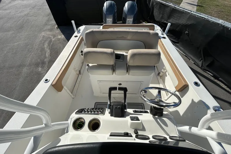Slide: The Image of 2016 NauticStar 25 XS boat interior with steering wheel and seating. - 39