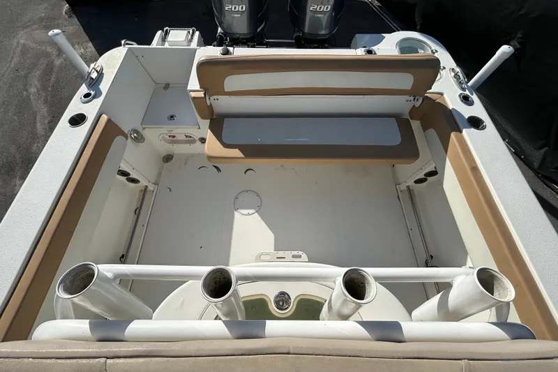 Slide: The Image of 2016 NauticStar 25 XS boat interior with rod holders and seating. - 40