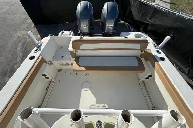 Slide: The Image of 2016 NauticStar 25 XS boat interior with dual 200 engines, spacious seating, and rod holders. - 41