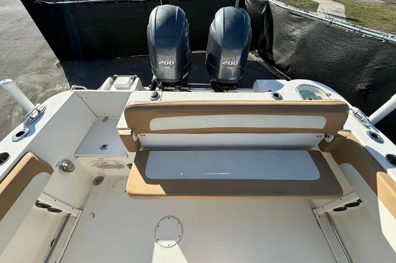 Slide: The Image of 2016 NauticStar 25 XS boat interior with dual 200 engines and seating area. - 42