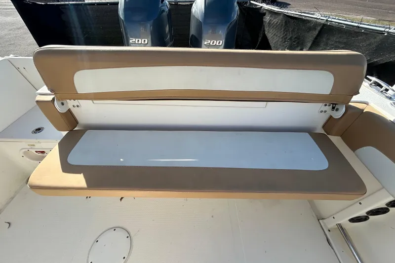 Slide: The Image of 2016 NauticStar 25 XS boat with tan and white seating, dual 200 engines. - 52