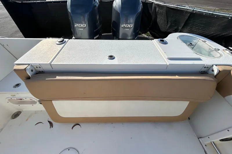 Slide: The Image of 2016 NauticStar 25 XS boat with dual Yamaha 200 engines, rear seating, and storage area. - 53