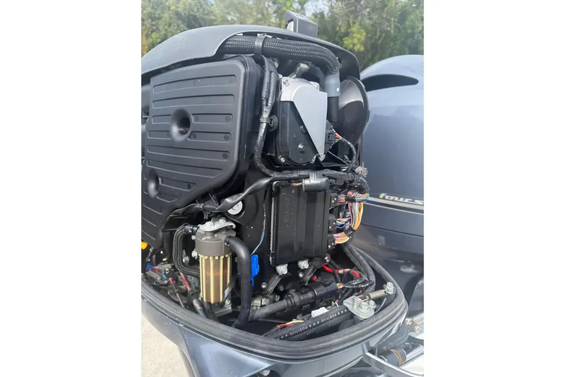 Slide: The Image of 2016 NauticStar 25 XS boat on trailer under sunny sky. - 9