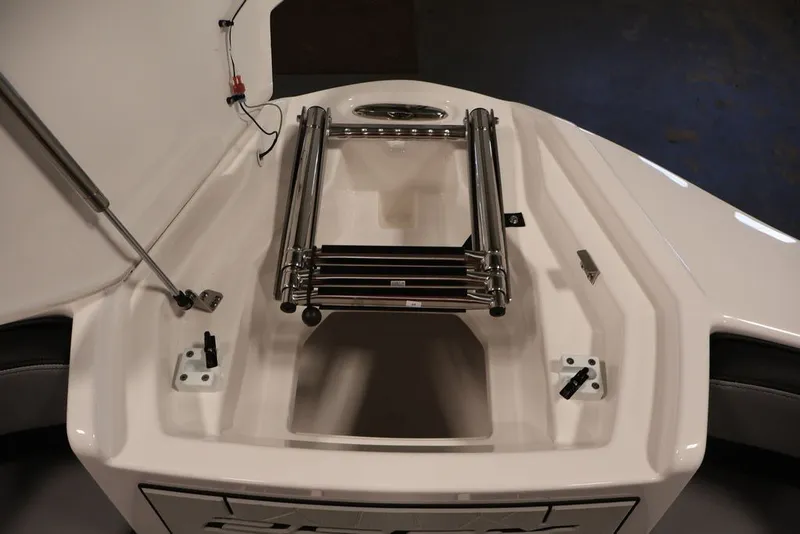 Slide: The Image of 2026 Yamaha Boats 255XE bow with stainless steel ladder and storage compartment. - 34