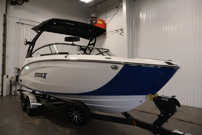 Slide: The Image of 2026 Yamaha Boats 255XE on trailer in indoor storage facility. - 59