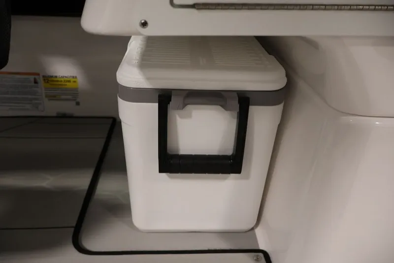 Slide: The Image of White cooler stored under seat in 2026 Yamaha Boats 255XE. - 20