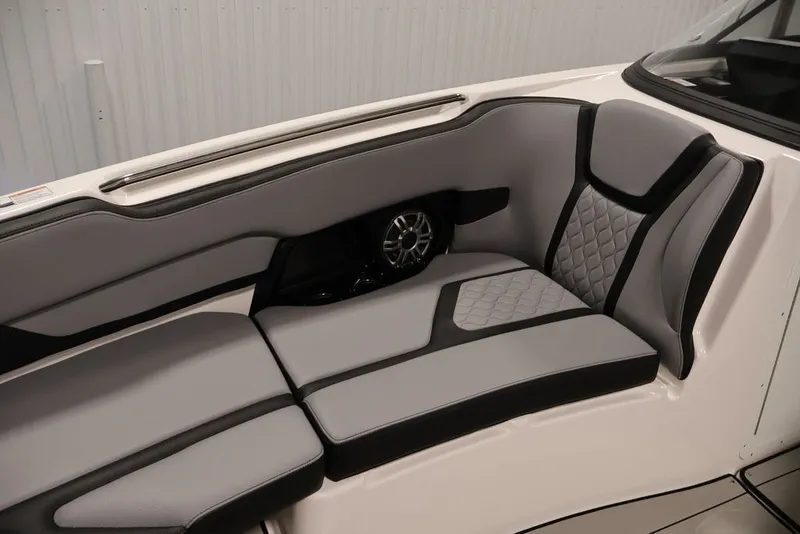 Slide: The Image of 2026 Yamaha Boats 255XE interior with sleek gray seating and modern design. - 56