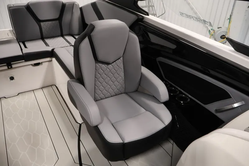Slide: The Image of 2026 Yamaha Boats 255XE interior with sleek, modern seating and stylish design. - 19