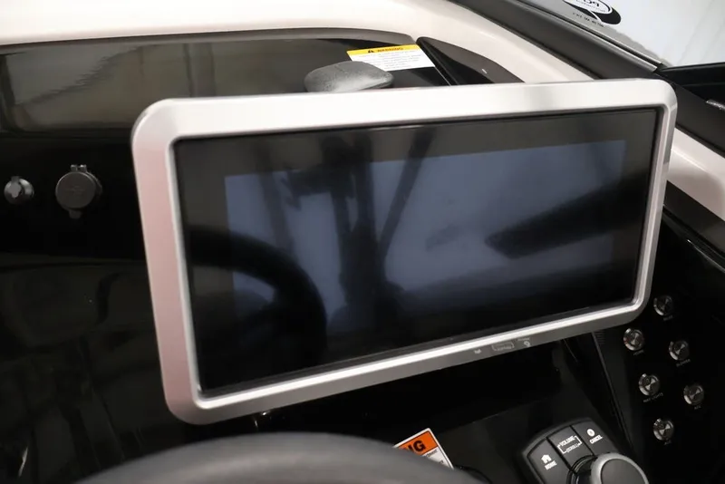 Slide: The Image of Dashboard touchscreen of 2026 Yamaha Boats 255XE, featuring modern controls and sleek design. - 53