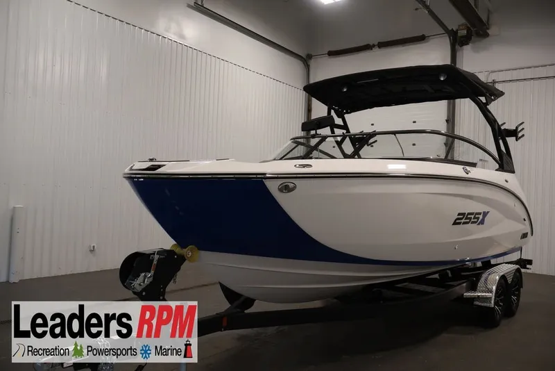 Slide: The Image of 2026 Yamaha Boats 255XE in showroom, featuring sleek design and modern features. - 0