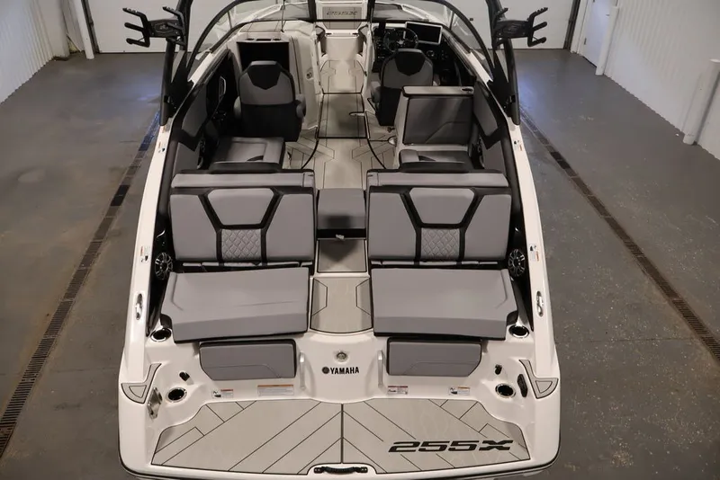Slide: The Image of 2026 Yamaha Boats 255XE interior, showcasing sleek seating and modern design. - 37