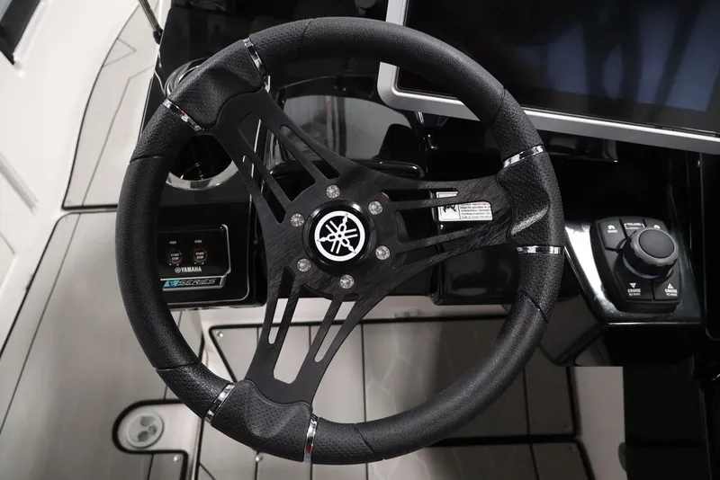 Slide: The Image of Steering wheel of 2026 Yamaha Boats 255XE, featuring sleek design and advanced controls. - 46